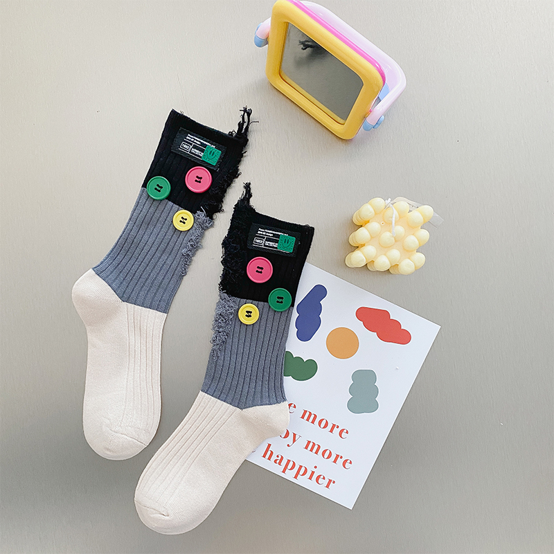 Geknöpfte Bettler-Farbblocksocken